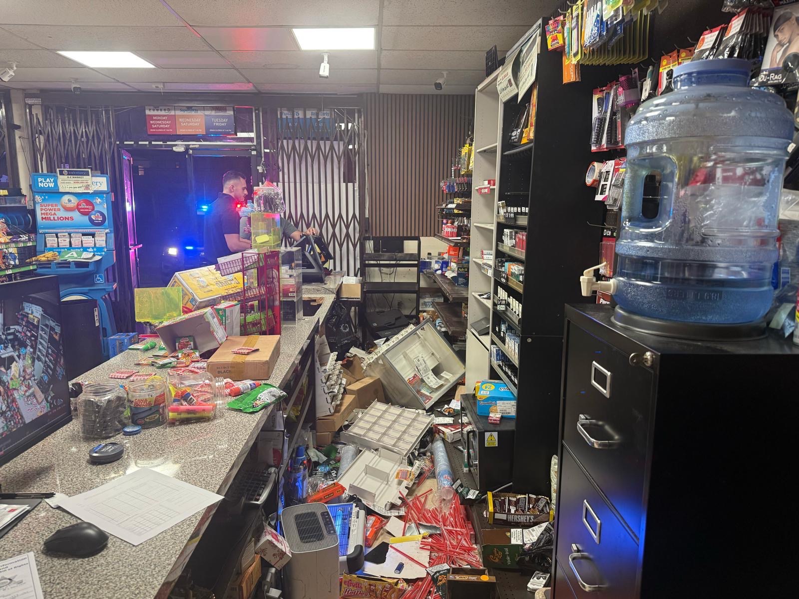Dozens of looters destroyed our family store campaign photo, 2 of 8