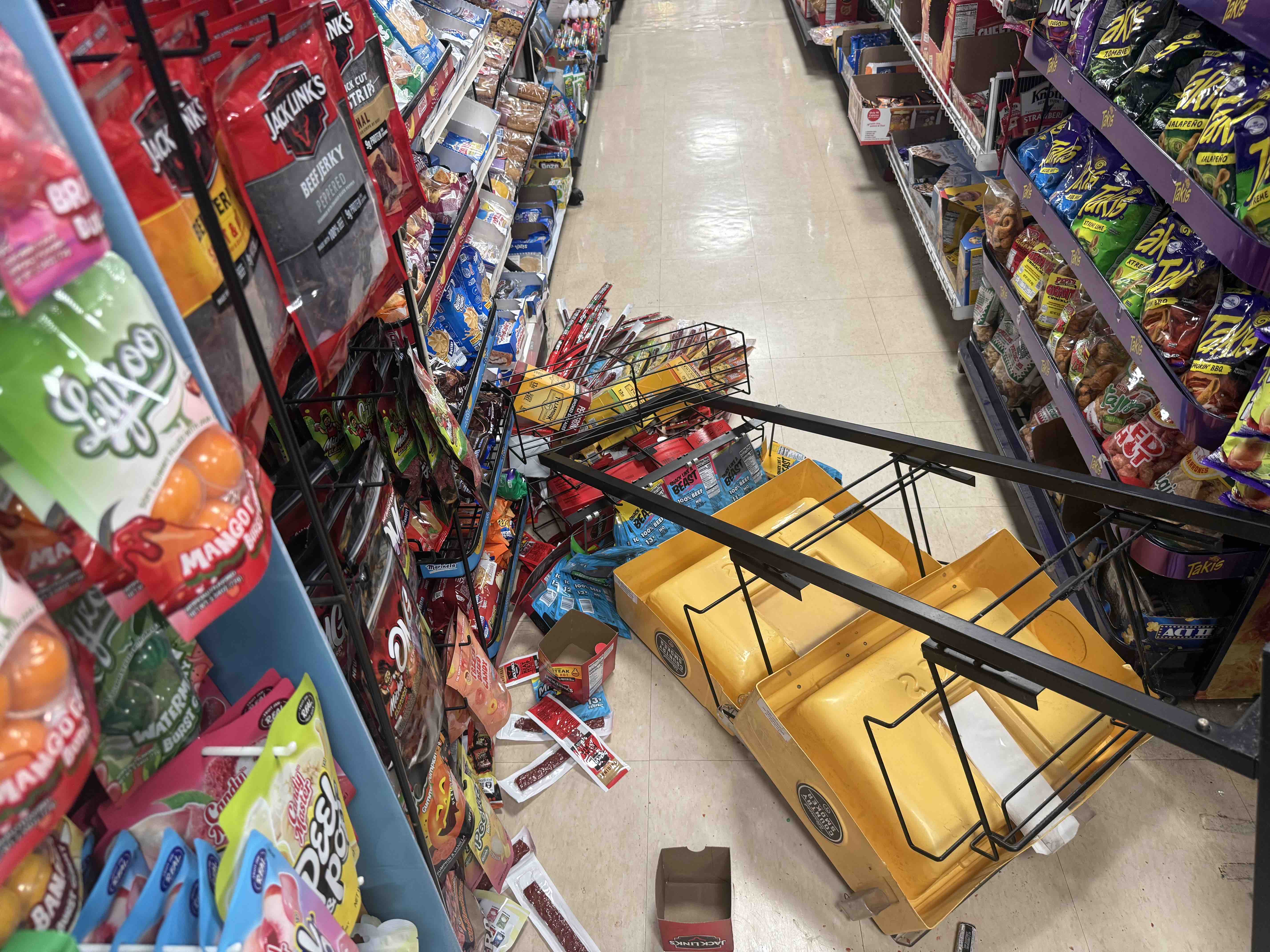 Dozens of looters destroyed our family store campaign photo, 9 of 13