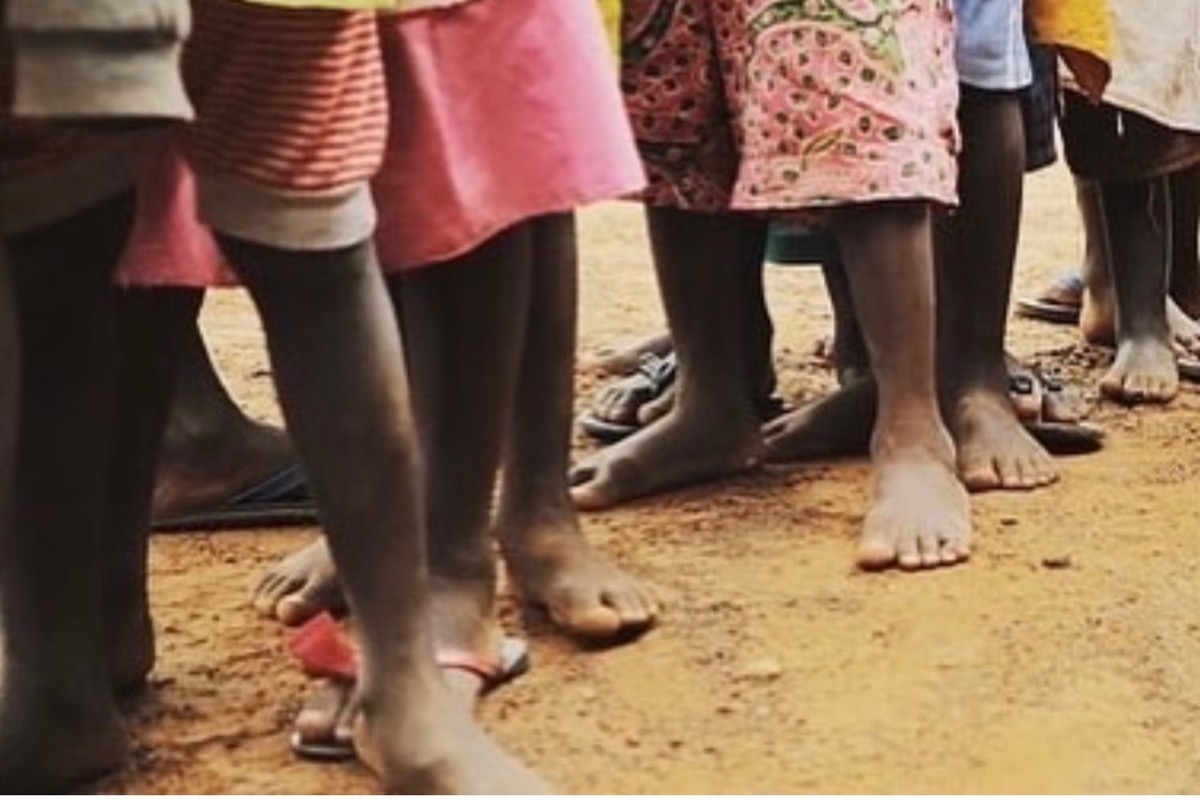 Shoes for children walking barefoot daily in Ghana photo
