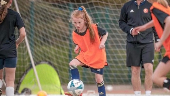 Help get Mia to France for a football tournament photo