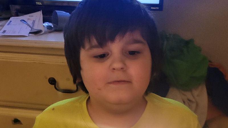 8 year old shot while looking at Christmas lights photo