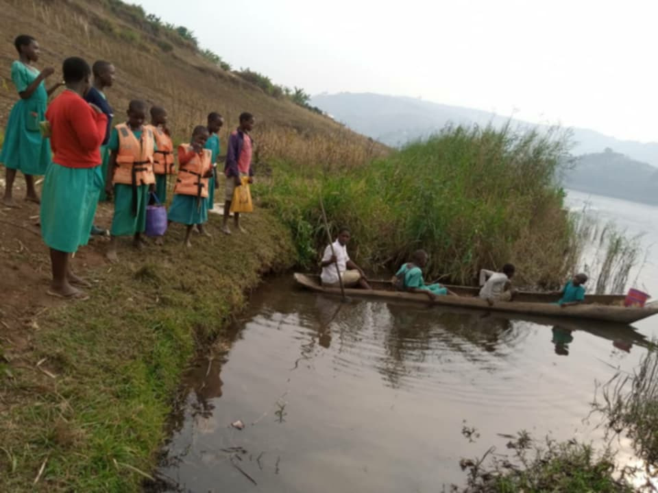 Motorboat for Bukome island on Lake Bunyonyi, Uganda campaign photo, 2 of 7