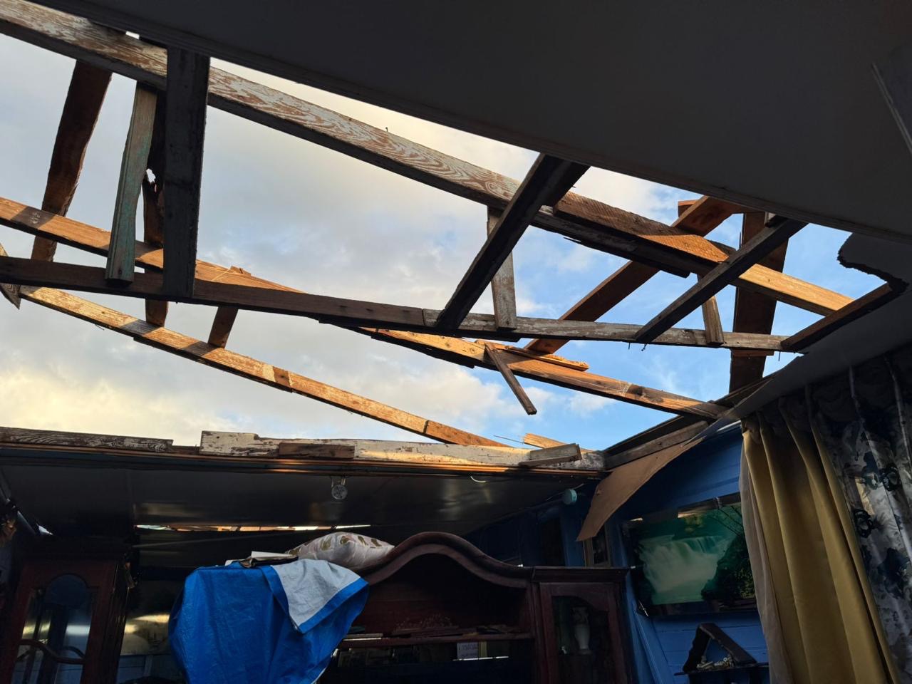 This is to help Assaney and his family rebuild their roof campaign photo, 4 of 8