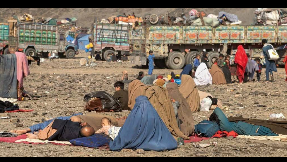 Winter Bites Hard: Afghans waiting for warmth and food. photo