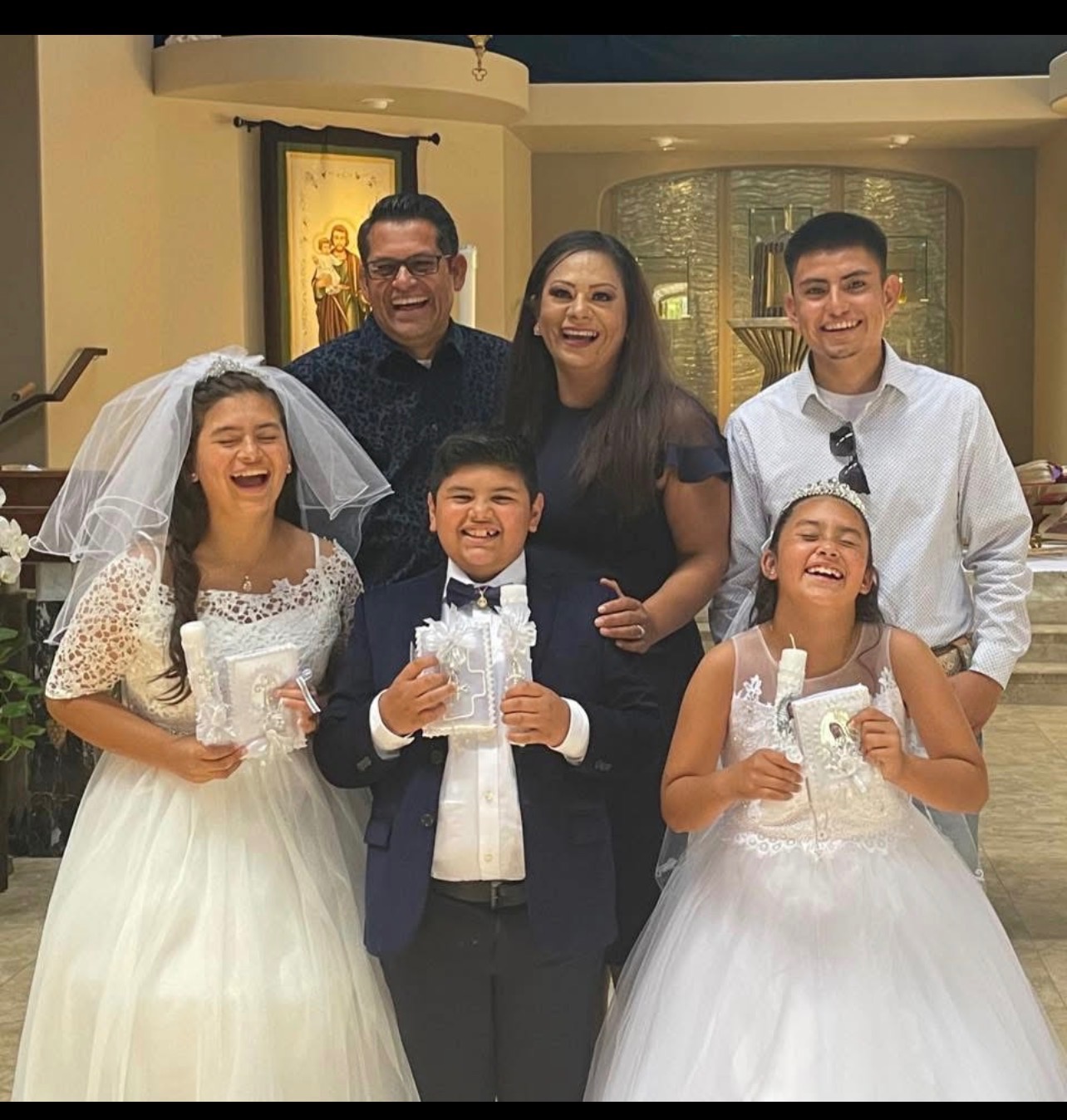 Standing with Vanessa and her kids in their Time of Need campaign photo, 2 of 8