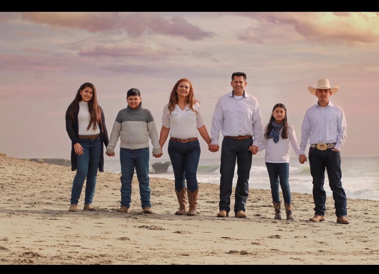 Standing with Vanessa and her kids in their Time of Need campaign photo, 7 of 8